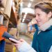 warehouse management system worker with barcode scanner